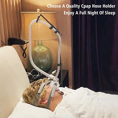 Person using CPAP hose holder while sleeping