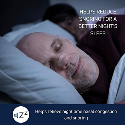 Man sleeping with a nasal strip, promoting better sleep and reduced snoring.
